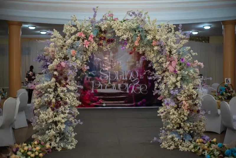 Floral “Spring of Provence” archway styled for a corporate dinner