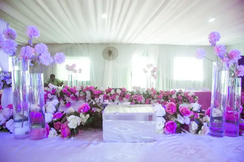 White marquee reception styled with pink and white florals