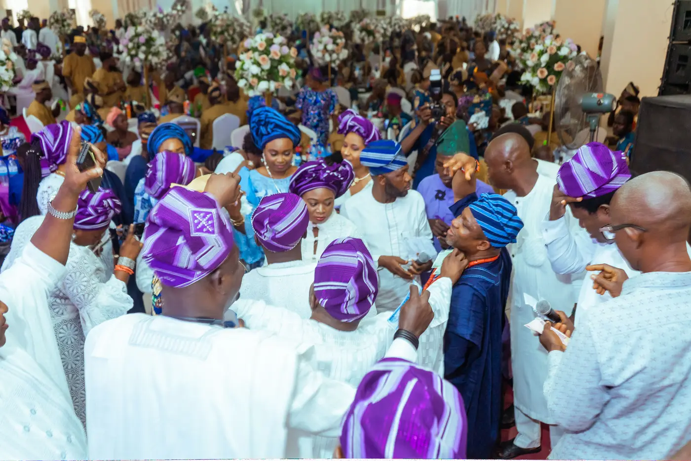 Guests in matching aso-ebi celebrating together at a Pleasant Jay Events celebration